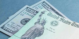 $100 bill and U.S. Treasury check.