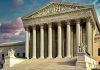 SCOTUS Ruling Stuns – How Was This Legal? Building with columns and statues in front of entrance.