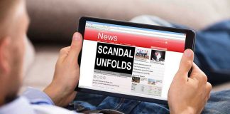 Person reading tablet with headline Scandal Unfolds.