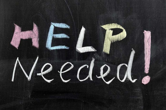 94485058 Help Needed written in colorful chalk.