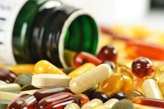 shutterstock_81980767.jpg Assorted vitamins and supplements scattered around an overturned bottle