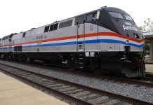 Amtrak Train SLAMS Semi—129 Aboard! Amtrak locomotive parked at a railway station