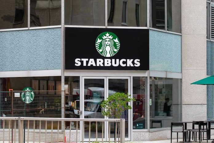 2320394477 Starbucks storefront with glass doors and logo