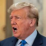 Epstein’s GIRLFRIEND Breaks Silence – Trumps Team Panics! Man in suit with open mouth, speaking passionately.