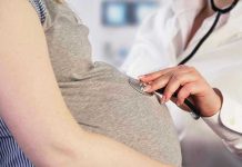 Woman Suffers Miscarriage—Faces Federal Charge Doctor uses stethoscope on pregnant womans belly.