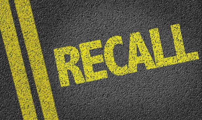 Yellow RECALL text on asphalt background.