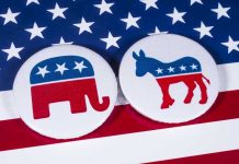 GOP Troll Dem Candidate -He Was Fuming! Republican elephant and Democrat donkey on American flag.