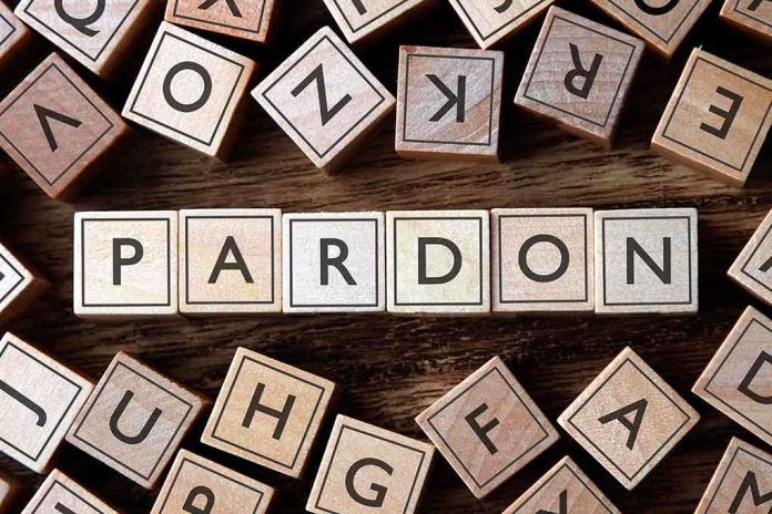 Wooden letter blocks arranged to spell 'PARDON' on a wooden surface
