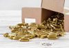 MURDER Filmed — Wife’s Cold-Blooded Act Box of brass bullets spilled on wooden surface.