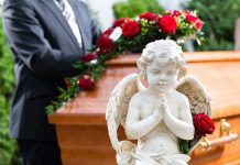 Mother RAGES: Someone Killed My Daughter Statue of angel in front of coffin with roses.