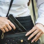 HORRIFIC Family Tragedy – Colorado Mom Accused Person placing gun into a handbag.