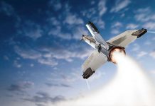 Wheelchair Astronaut Mission SHOCKS Space World Rocket launching into the sky with clouds.