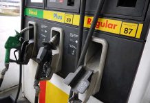 Gas station pumps for diesel, plus, and regular fuel.