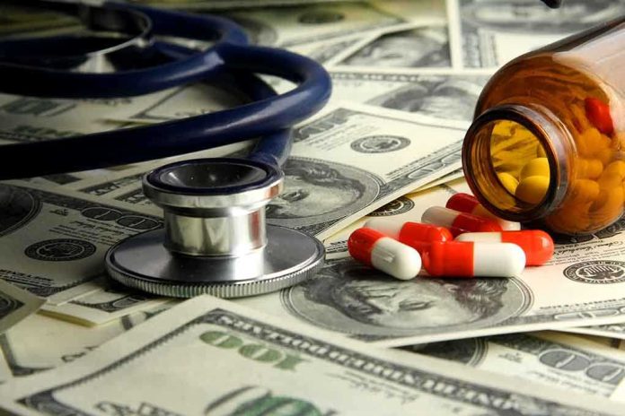 shutterstock_114994537.jpg Stethoscope and prescription pills on a background of dollar bills