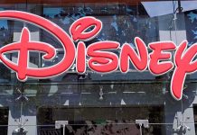 Bright red Disney logo displayed on a storefront window