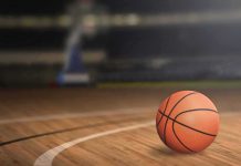 Basketball Star GUNNED DOWN Outside Party A basketball on a wooden court
