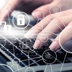 Hands typing with cybersecurity icons overlay.