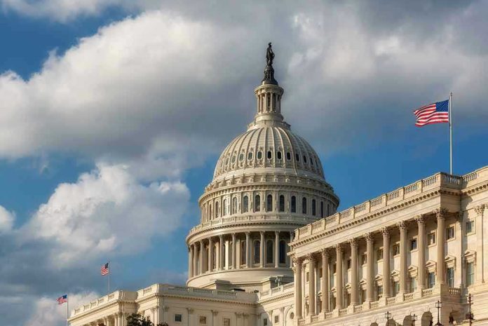 1896126403 US Capitol Building with American flags and clouds