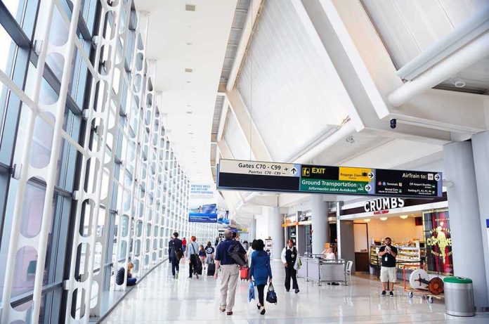 People walking in a brightly lit airport terminal.