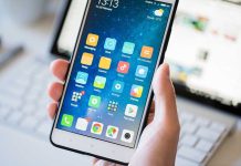 Government-Funded Game Creates Viral Nightmare A person holding a smartphone displaying various mobile applications