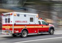 Stolen Ambulance WEAPONIZED In Planned ATTACK Red and white ambulance driving on street.