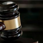 Quran Burner Stabbing Shocks London Court Close-up of a judges gavel.