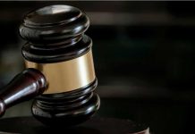 Quran Burner Stabbing Shocks London Court Close-up of a judges gavel.