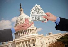 $233M Obamacare SCAM Stuns Prosecutors Hands exchanging money in front of Capitol building.