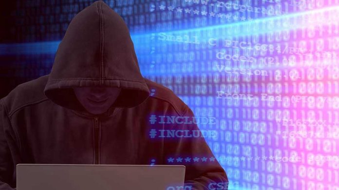 Person in hoodie using laptop, surrounded by digital code.