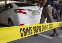 Renowned Scientist Killed – Suspect’s Alarming Past Crime scene tape blocking off white sedan.