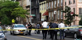 Nightclub RAMPAGE — Carnage Across Pavement Police gathered at an urban crime scene.