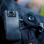 Body camera attached to a black uniform.