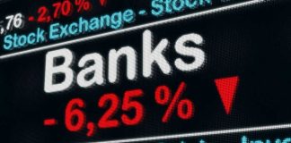 Stock exchange displays bank crisis percentage decrease.