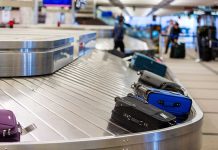 Shutdown Chaos Hits Airports Luggage on a conveyor belt at an airport baggage claim area