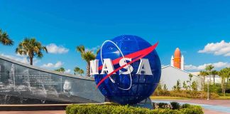 Nine Scientists DEAD — NASA Says Nothing NASA logo sculpture with spaceship and palm trees.