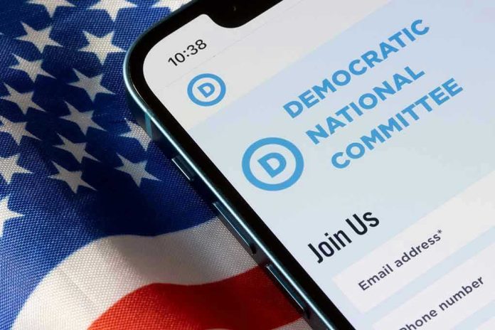 2223653467 Phone displaying Democratic National Committee website over flag.