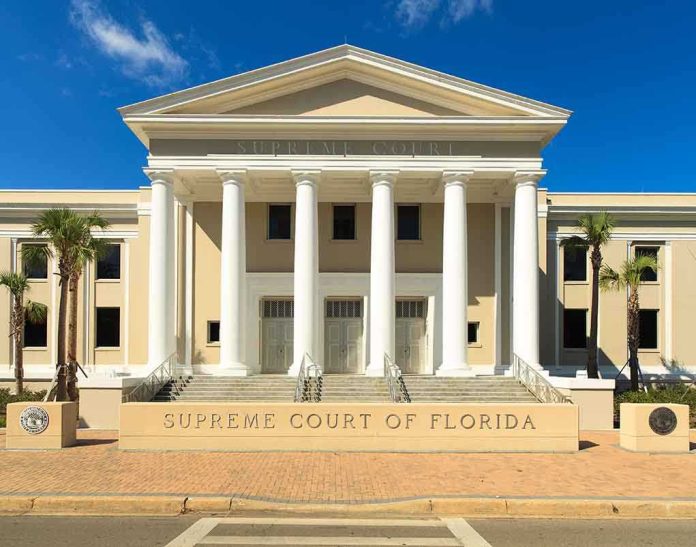 shutterstock_141950806.jpg Exterior view of the Supreme Court of Florida with columns and palm trees