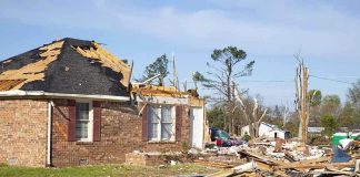 Massive Hailstorm Wreaks HAVOC in Farm Country A severely damaged house with debris scattered around from a storm