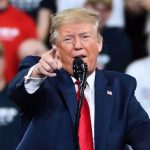 Trump’s Bizarre Praise: Xi ‘Central Casting’ Strongman Man in suit pointing, speaking at a rally.