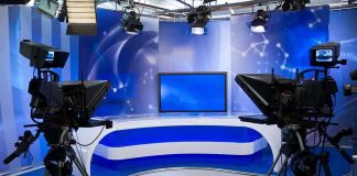 Candace vs. Kirk: Truth Still Hidden A television studio setup with cameras and a blue backdrop