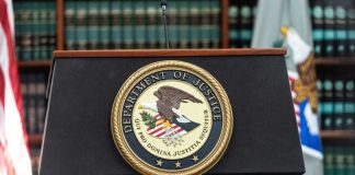 CHAMBERS SCANDAL Rocks Federal Bench Podium with the Department of Justice seal and American flag in the background