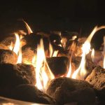 Recalled Fire Pit Explodes — Child Burned Fire pit flames over lava rocks at night