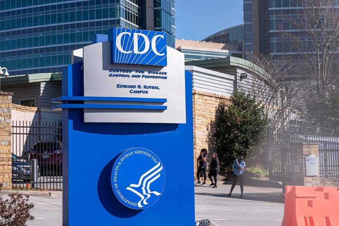 CDC campus entrance sign with modern buildings in background