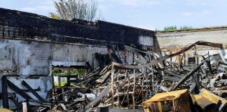 Drone Barrage Torches Russia’s Amazon Burned building interior with collapsed charred debris