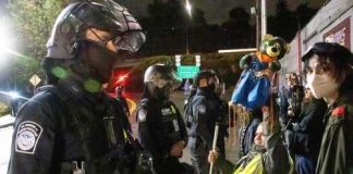 ICE Shooting Sparks Maine Firestorm Law enforcement officers facing protesters at night