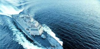 Oil Lifeline Under Fire Naval warship cutting through open sea