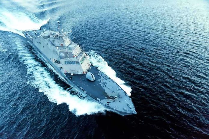 shutterstock_724184326 Naval warship cutting through open sea