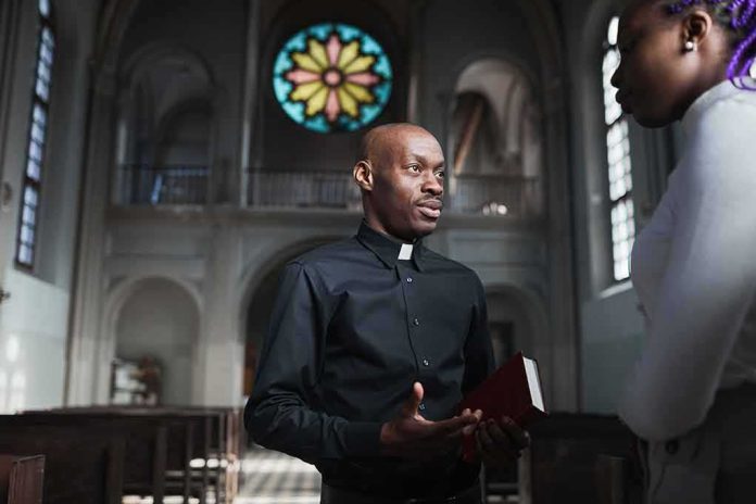 Priest talking with a visitor inside a church