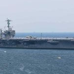 Aircraft carrier sailing at sea