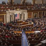 Legislative chamber filled with attendees during a formal address